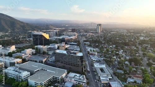 Aerial stock drone footage of Burbank, California flying towards Warner Bros and Universal Studios at sunset photo