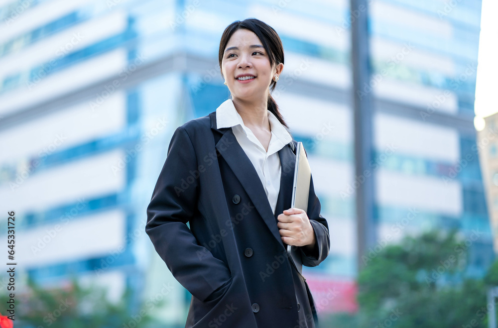 Asian businesswoman walking on the street Asian businesswoman walking on the street