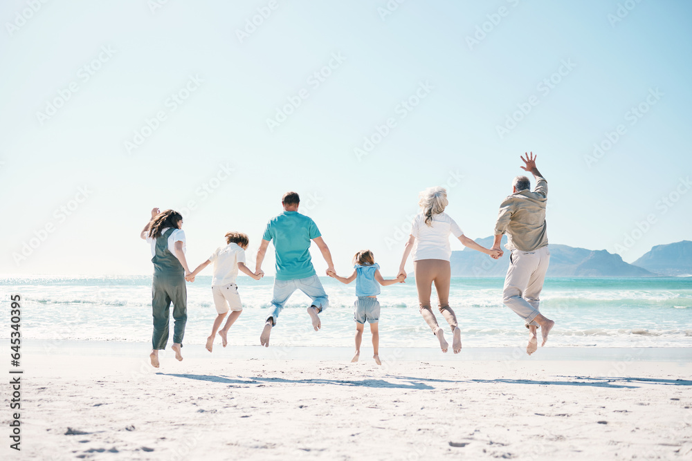 Jump, travel and holding hands with big family on the beach for support, summer vacation or bonding. Freedom, health and love with people on seaside holiday for adventure, trust or happiness together