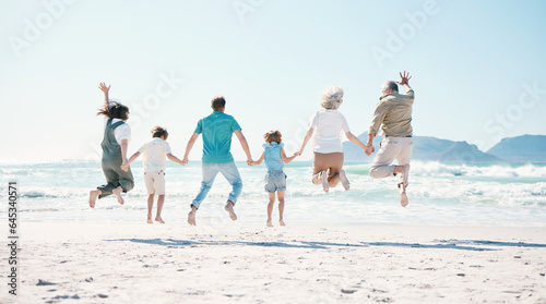 Jump, energy and holding hands with big family on the beach for support, summer vacation and travel. Freedom, health and love with people on seaside holiday for adventure, trust or happiness together