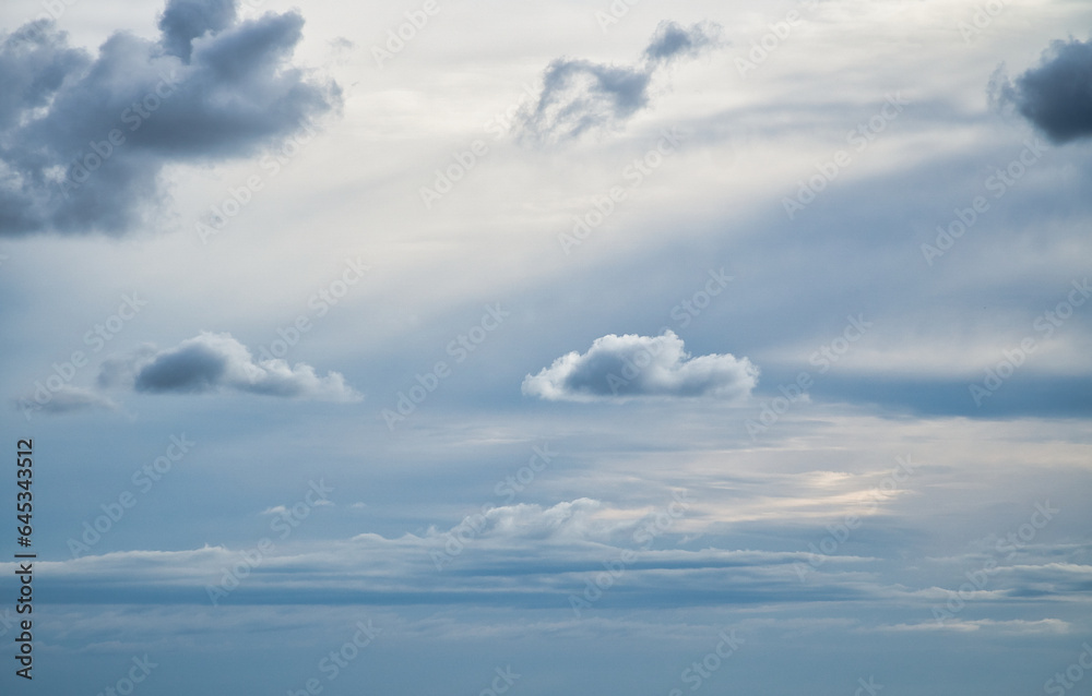 Clouds in the sky. Background image template. light cloud cover with soft sunlight