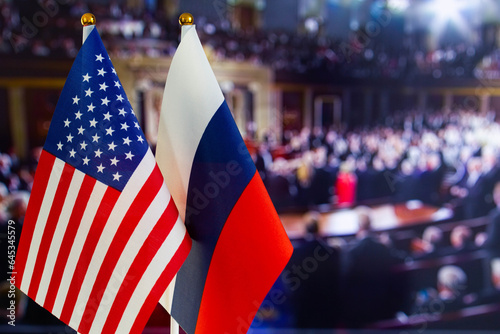 The US flag  Russian flag with copy space for text. Flag of USA  flag of Russia. The United States of America and the Russian Federation confrontation. Russia s invasion of Ukraine