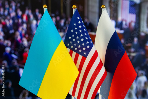 The US flag, Russian flag, Ukraine flag. Flag of USA, flag of Russia, flag of Ukraine. The United States of America and the Russian Federation confrontation. Russia's invasion of Ukraine