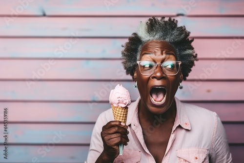 middle-aged black woman holds and eats an ice cream
