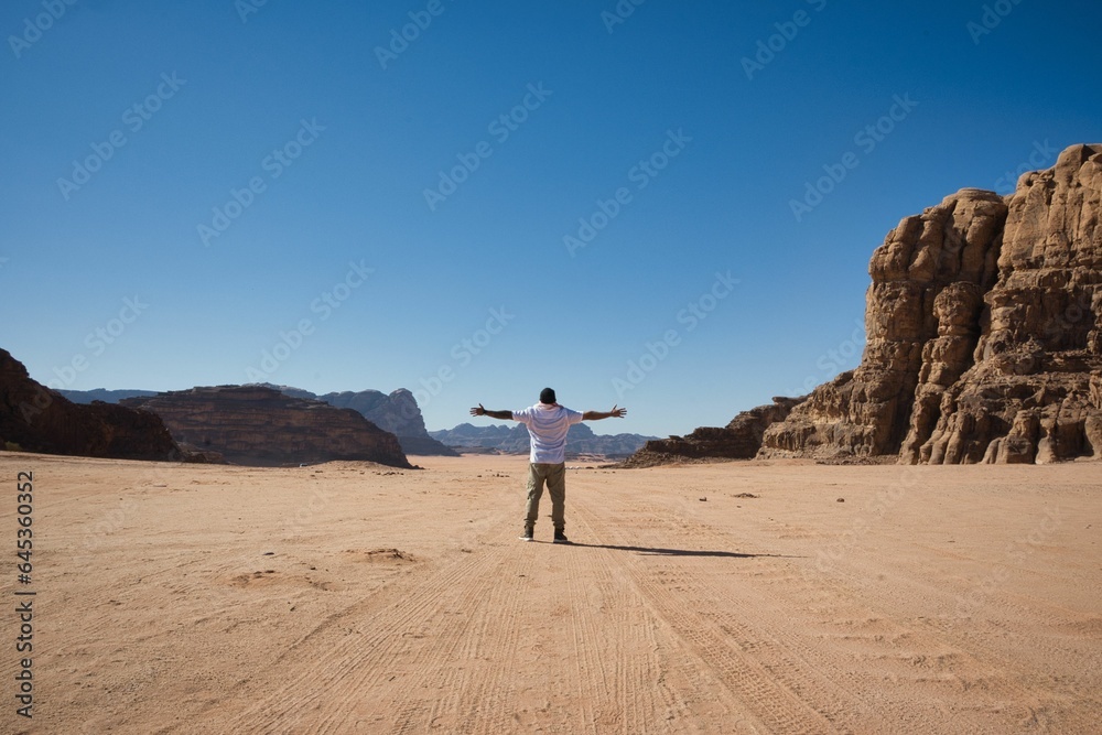 man alone in the middle of wadi rum