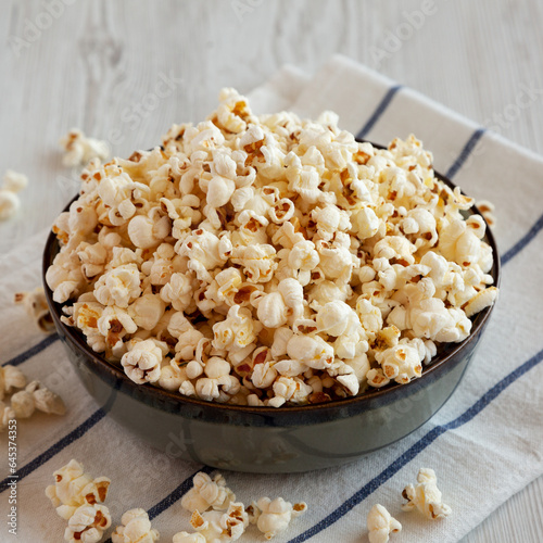 Homemade Buttered Popcorn with Salt in a Bowl, side view.