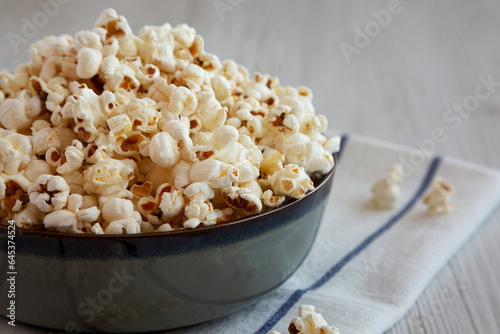 Homemade Buttered Popcorn with Salt in a Bowl, side view. Copy space.