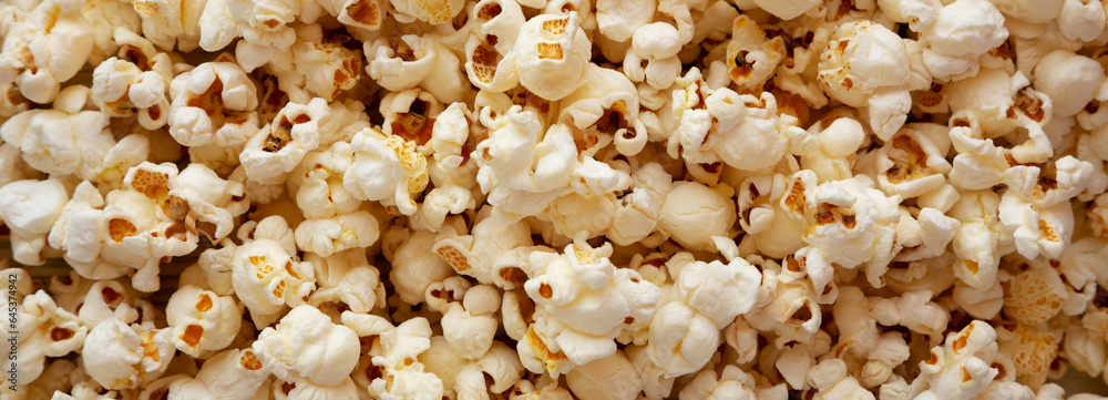 Homemade Buttered Popcorn with Salt, top view. Flat lay, overhead, from above. Homemade Buttered Popcorn with Salt, top view. Flat lay, overhead, from above.