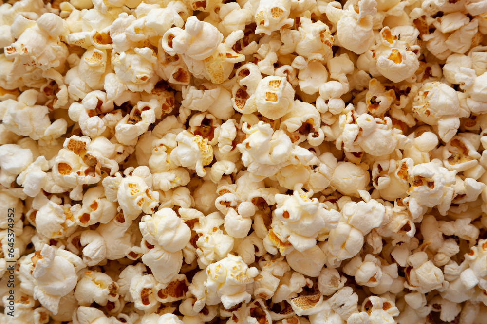 Homemade Buttered Popcorn with Salt, top view. Flat lay, overhead, from above. Homemade Buttered Popcorn with Salt, top view. Flat lay, overhead, from above.