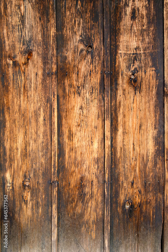 The wood detail of Japanese old doors reflects a deep appreciation for nature and the natural beauty of wood. Each door reveals a unique grain pattern, as if a piece of art created by nature itself. photo