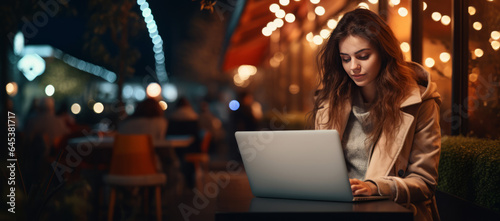 Female entrepreneur having a virtual business meeting at night