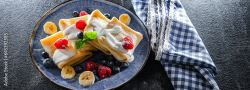 A plate of pancakes filled with sweet cottage cheese photo