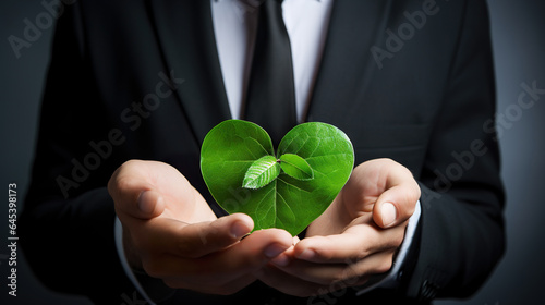 business man in suit hold green leaf if love shape, responsible friendship and care of business and nature concept, generative AI