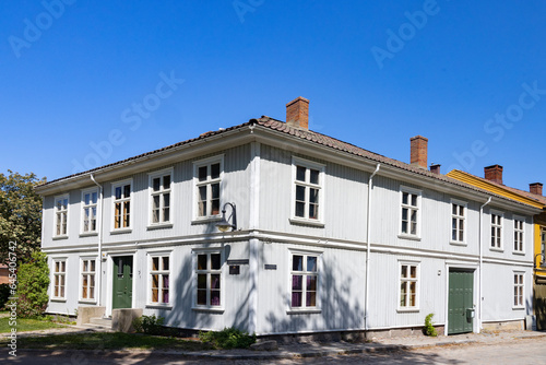 Happy walking in old Fredrikstad on a great warm summer day, with many old buildings, Norway 