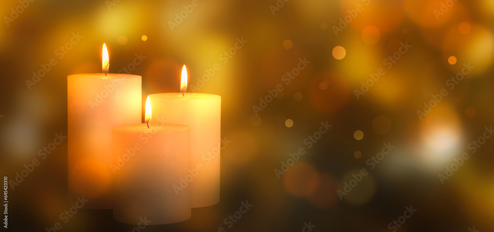three white burning candlelights isolated on blurred abstract background with golden bokeh lights, advent season decoration in warm atmosphere