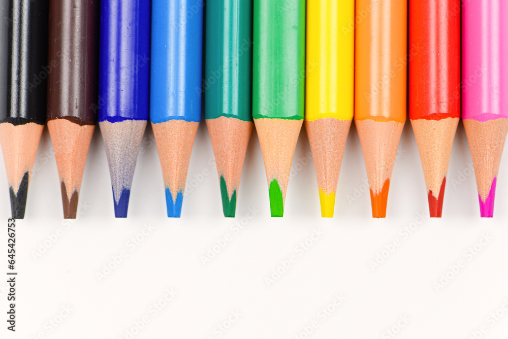Colored pencils individually on a white background. Close-up. Colored pencils individually on a white background. Close-up.