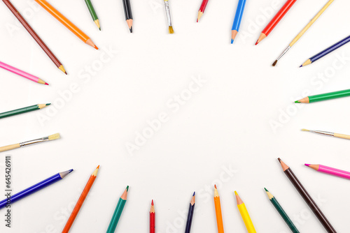 Colored pencils individually on a white background. Close-up.