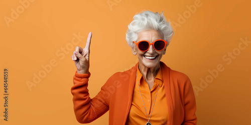 a beautiful old woman laughing on a plain red background, fashion