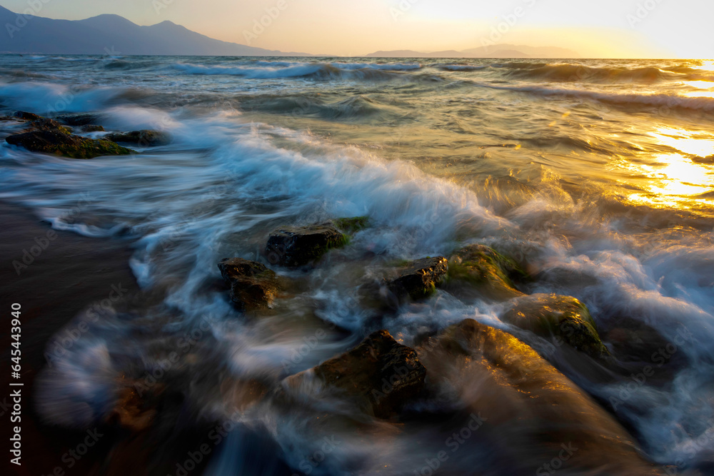 A seascape photographed with a long exposure technique at sunset. A seascape photographed with a long exposure technique at sunset.