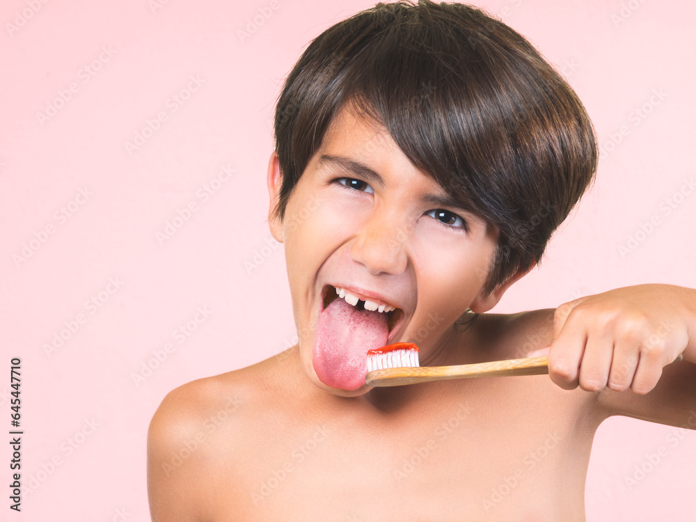 Child brushing his teeth and sticking out his tongue. Child brushing his teeth and sticking out his tongue.