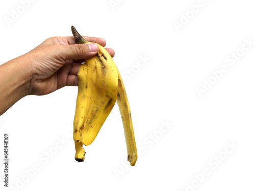 A banana peel in hand isolated on white background with clipping path, food and health concept, PNG.
