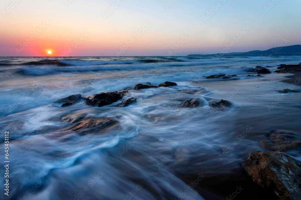 A seascape photographed with a long exposure technique at sunset. A seascape photographed with a long exposure technique at sunset.