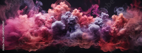 Dense multicolored smoke of red, purple and pink colors on a black isolated background.