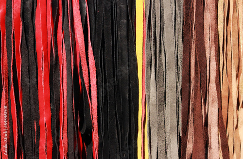 leather whips in different colors at the bdsm fair