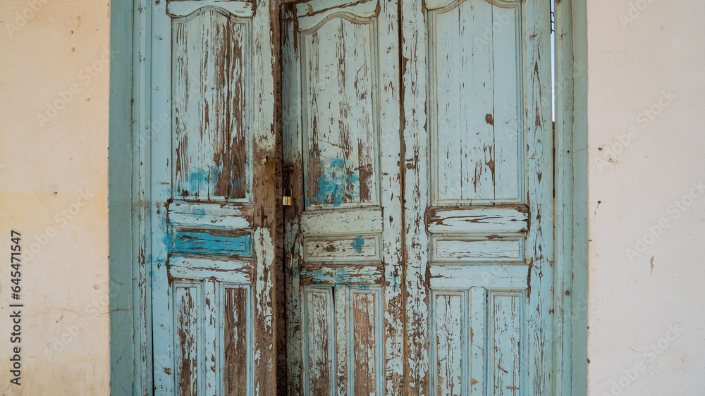 Old blue wooden door in a mediterranean city, Sousse, Tunisia.