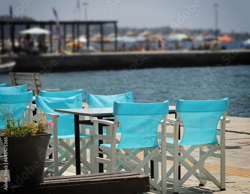 Restaurant with light blue chairs © KSCHiLI