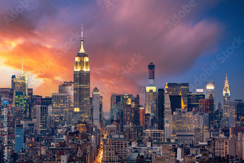 Aerial view of New York City from downtown to midtown along 5th Avenue at dusk