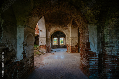 Large ancient vaulted corridor of abandoned church, castle etc.