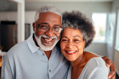 Timeless Love: A Happy Senior Black Couple Grinning in a Cherished Family Portrait.   © Mr. Bolota