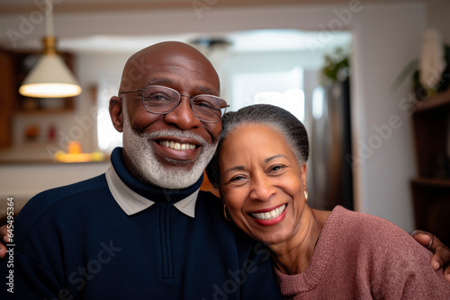 Timeless Love: A Happy Senior Black Couple Grinning in a Cherished Family Portrait.