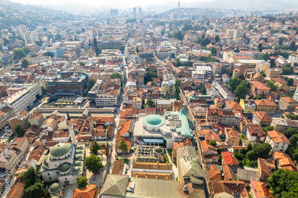 Bascarsija old bazaar streets with Gazi Husrev-beg Mosque and downtown in the background, aerial view, Sarajevo, Bosnia and Herzegovina