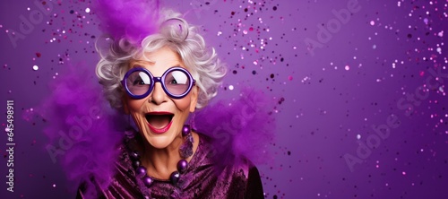 Happy Mature Woman with Grey Hair Celebrating New Years Party on a Purple Background with Space for Copy
