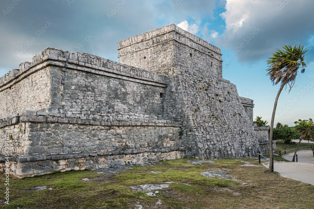 Tulum, Mexico, Dec 2017. Temple of the Stela, the name of a Mayan engraved monolith, a large stone portrays in low relief a standing Maya lord, with inscription in Mayan hieroglyphs. 