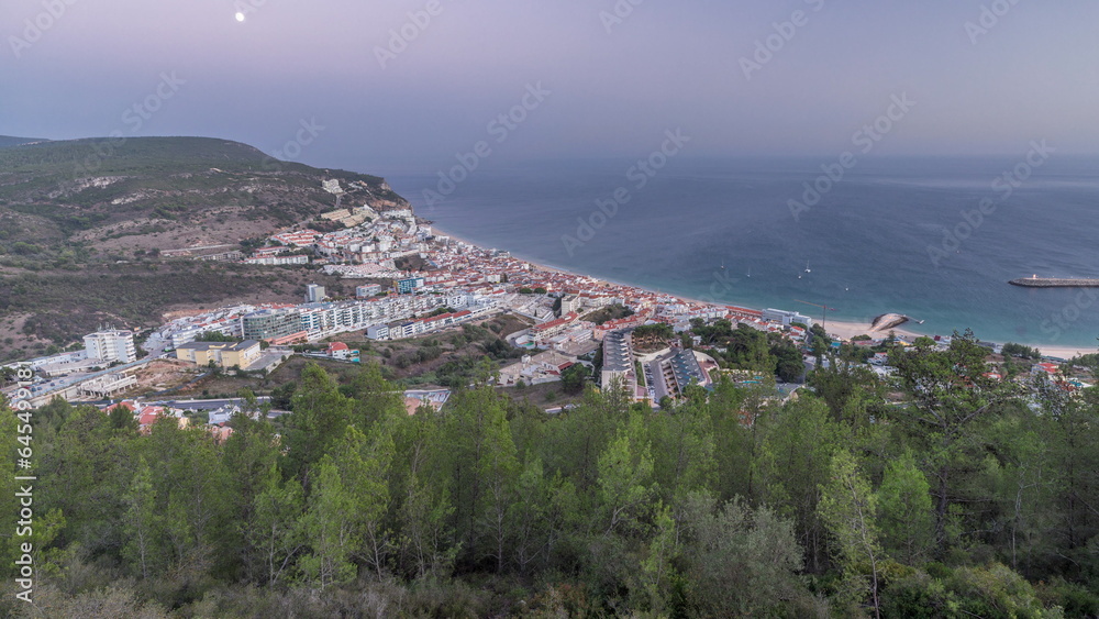 Aerial view of the coastline of the village of Sesimbra day to night timelapse. Portugal Aerial view of the coastline of the village of Sesimbra day to night timelapse. Portugal