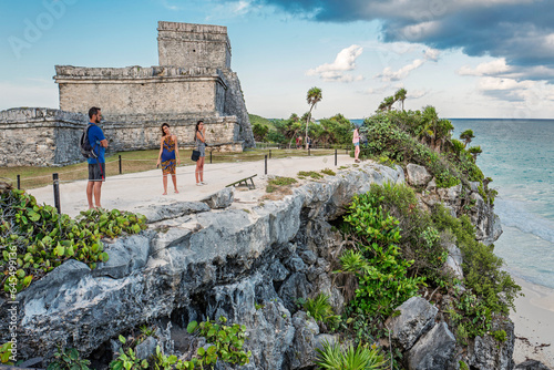 Tulum, Mexico, Dec 2017. Temple of the Stela, the name of a Mayan engraved monolith, a large stone portrays in low relief a standing Maya lord, with inscription in Mayan hieroglyphs.  photo