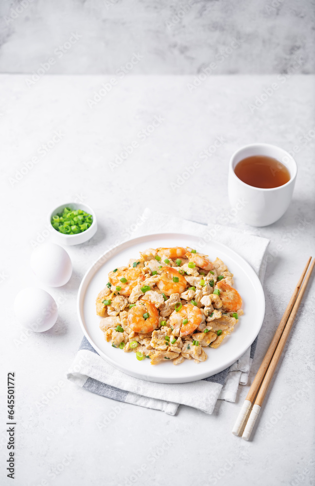 Shrimp scrambled eggs with scallion in a plate Shrimp scrambled eggs with scallion in a plate