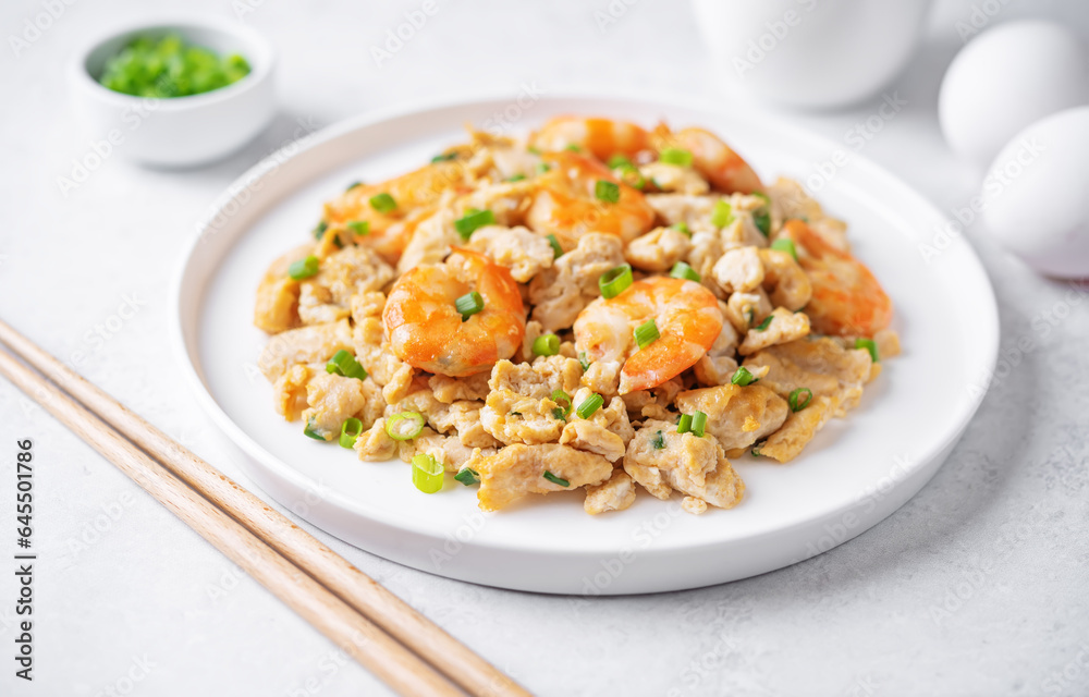 Shrimp  scrambled eggs with scallion in a plate