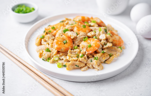 Shrimp scrambled eggs with scallion in a plate