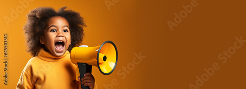 African american child kid screaming in megaphone loudspeaker, studio yellow background. Important announcement news, significant messages sale discount concept. Empty space place for text copy paste