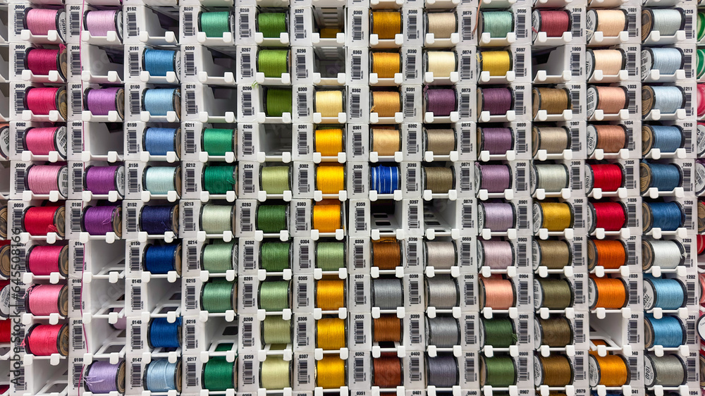 Fototapeta premium Hand embroidery floss on spools rainbow collection. Sewing threads. Mouline thread. Mouline or muline thread. Premium craft floss. Equipment or supplies for professional tailoring. Handmade decor. 