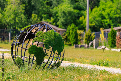 Green planet globe. Background with selective focus and copy space © Iurii Gagarin