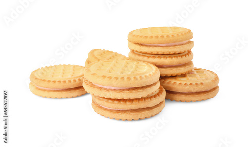 Many tasty sandwich cookies with cream isolated on white