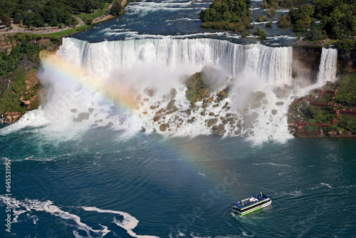 Aerial view of American and Bridal Veil Falls including maid of the Mist boat sailing on Niagara River  Canada and USA natural border