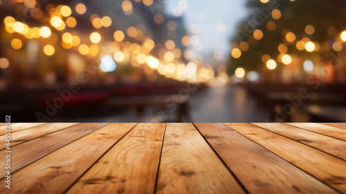Empty white wooden table for product placement or montage with focus to table top in the foreground  with a restaurant in the background  its colors and details softened by a bokeh effect.