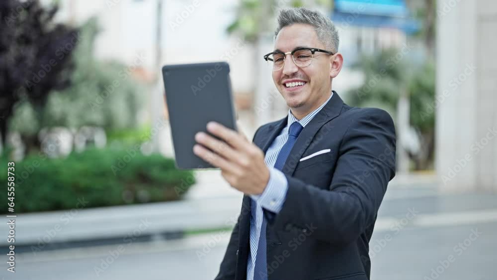 Young hispanic man business worker smiling confident having video call at street Young hispanic man business worker smiling confident having video call at street