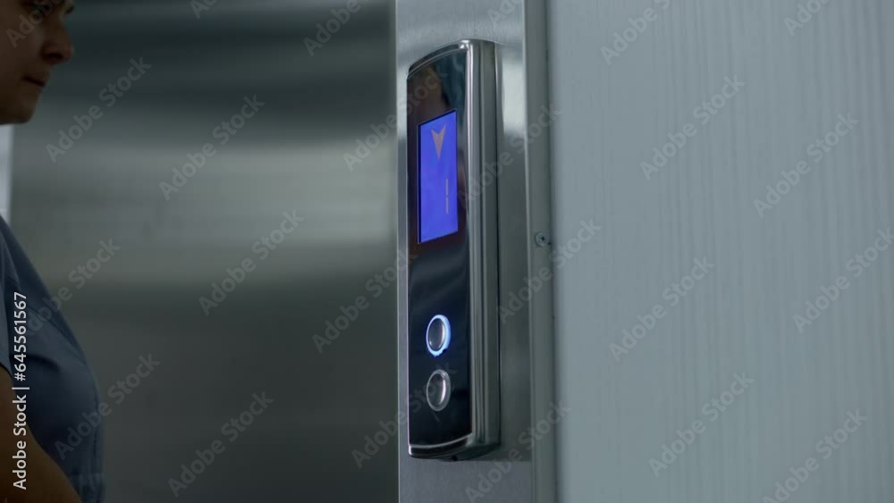 Close up shot of nurse in uniform coming to elevator door and pressing call button. Health care specialists at work in modern hospital. Medical worker uses elevator in working process. Static shot. Close up shot of nurse in uniform coming to elevator door and pressing call button. Health care specialists at work in modern hospital. Medical worker uses elevator in working process. Static shot.